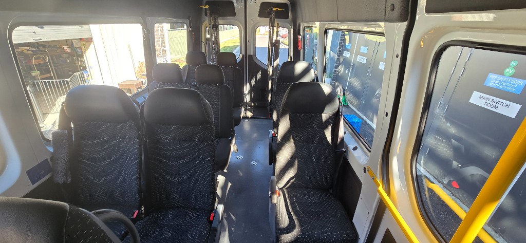 Clean commercial shuttle bus interior after detailing